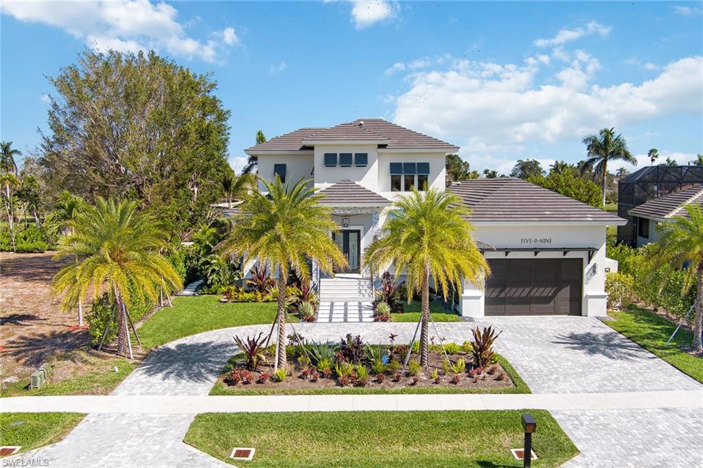 An exquisite piece of paradise awaits on Marco Island. Perfectly nestled adjacent to the exclusive Island Country Club, this professionally designed and decorated masterpiece encompasses four en-suite bedrooms within 3,769 square feet of luxurious living space. The inviting interior is comprised of a spacious kitchen and living area that create the perfect environment for entertaining. For a seamless indoor-outdoor lifestyle, accordion doors open to a tranquil pool and spa that offer breathtaking views of the golf course. This opulent oasis is complete with a built-in grill and refrigerator for alfresco dining, a gas fireplace and ample seating space, all enclosed by hurricane-grade screens for peace of mind. With state-of-the-art finishes from start to finish, additional appointments include a Sonos speaker system throughout, a smart home security system, a buried propane tank and a full-home generator. Being sold turnkey, this property presents an exceptional opportunity for those who seek an elegant escape, with no detail left unturned.
