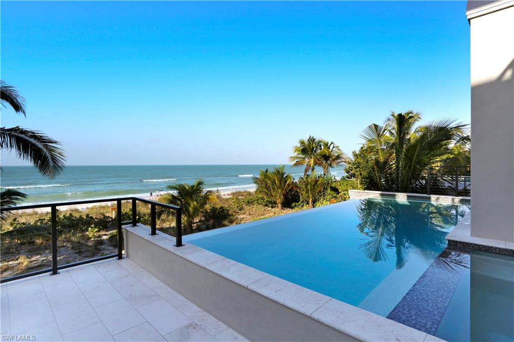 Brand new direct beachfront home by Windover Development now available. Embrace the appeal of 2017-construction with the Gulf of Mexico as your back yard. Offered impeccably-furnished/decorated by Freestyle Interiors in a coastal contemporary motif with all white oak floors & quartz, marble & granite countertops throughout. Here you will find only the finest craftsmanship from the concrete block construction & all hurricane impact doors/windows to the Crestron home automation system, electronic shade/hurricane shutter control, private elevator & huge garage for 4+ cars. Gourmet chef’s kitchen features all Thermador Professional appliances, oversized eat-in island, walk-in pantry & wine bar with cooler, all focused around the endless Gulf views. The main living space flows seamlessly via fully-pocketing sliders to the elevated outdoor deck with infinity edge pool & spa, summer kitchen with gas grill & and outdoor living space with mounted flat screen TV & fireplace. Master suite boasts generous His & Hers walk-in closets with California-style cabinetry, spa-like bath with freestanding tub & frameless shower & open-air balcony to enjoy the sound of the waves & year-round sunsets.