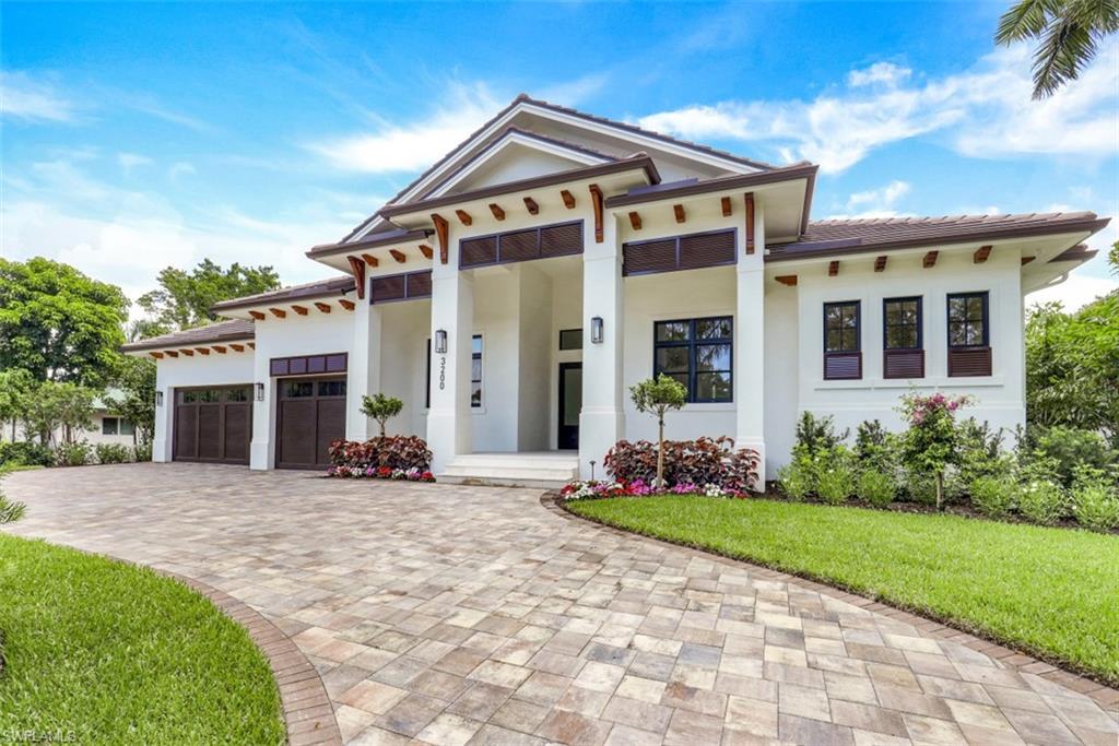 This new construction home in the coveted Moorings neighborhood was just completed in May 2022! The home is  completed, furnished, and ready for its new owners to move in immediately...no worrying about construction delays. The home has a large, open concept living area with high ceilings and large sliders to outside including a 0 corner slider. The kitchen features a hidden walk-in pantry, large island, gas stove/ovens, two dishwashers, a pot filler, and other high end finishes. All four bedrooms have en suite bathrooms and walk-in closets.  The master bedroom features a must-see master bathroom with dual vanities and an extra large shower with dual shower heads, his and her closets, and private entry to the pool area. A private office located off the living area is perfect for any professional working from home. The expansive outdoor area features multiple covered areas with electric screens. Outdoors you'll also find an outdoor kitchen, private pool with spa & sun deck, and a pool shower.  This is the best priced new construction home currently available in the Moorings or Park Shore areas.