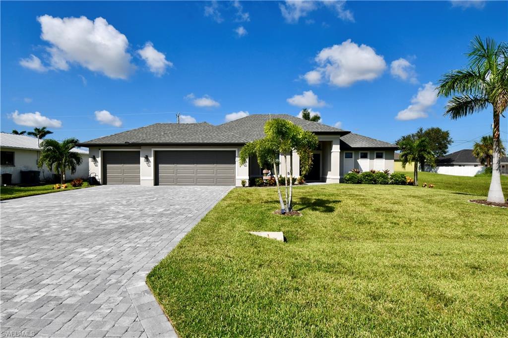 3+den with 2 full bath home that has it all! From the large 3 car garage w/epoxy floors to the enticing heated pool sporting a sun shelf, this house will meet your every need. Walk in & be greeted by the open concept living space, featuring tray ceilings in the living room, a large dining area, & a beautiful kitchen equipped w/soft close cabinets, breathtaking granite countertops, & stainless steel appliances. Off of the living room french double doors will lead you into the generously sized den. The laundry room is situated off of the kitchen & leading towards the garage.  This home features a split Florida floor plan, on one side you will find 2 generous bedrooms w/large closets & a guest bath w/a shower-tub combo. On the other side of the home is the master bed boasting tray ceilings & sliding glass doors leading to the oversized screened lanai.The master bathroom features double sinks, a separate water closet, & a lavish tile and glass shower w/a built in shelf.  Off of the master bath you find an impressive walk-in closet with 3 windows allowing for plenty of light to come in. If this weren't enough, the house is tiled throughout & all windows and doors are hurricane glass.