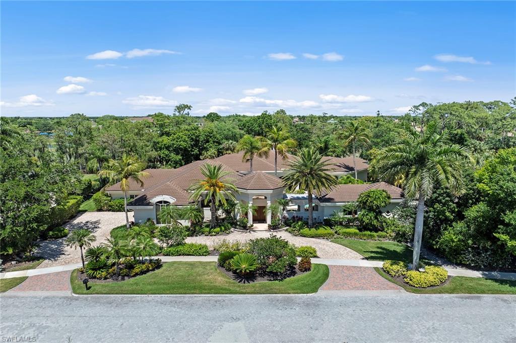 Tranquility abounds. Welcome to 4484 Brynwood Drive in exclusive Quail West Golf & Country Club. Through the entry double doors, go into a spa-like courtyard bubbling with water features, outdoor living and entertaining, and natural light splashing on the custom-sized pool. A footbridge leads one over the cascading water to a sizable casita fit with full bath and suited well for guests. Designed to amplify the lush greenery and engaging golf course views, every room of the 6,000-plus-square foot courtyard style residence feels private, engulfed in nature. A formal marble-laden living room and dining room flow between each other past a sizable foyer, with walls of glass behind both looking out to the first hole of the Preserve Course. The generously sized owner's suite encompasses the right side of this residence, past classic wooden bookshelves of the primary office. Within the primary suite find a courtyard pool and backyard views with sitting areas in both locations. Designed with future renovations in mind, the primary bath feature two separate showers, separate double vanities and two water closets. A sunken bar with wine coolers and bottle storage sits adjacent to the eat-in kitchen space, with flow into the luminous, considerably sized kitchen. Each of the three additional bedrooms has generous en-suite baths and closet space, with unique views of greenery or calming courtyard space. With a new roof and three-car garage, including space for a golf cart, craft your dream in one of the unique spaces Quail West has to offer.  A Transferable House Membership is available with this home!