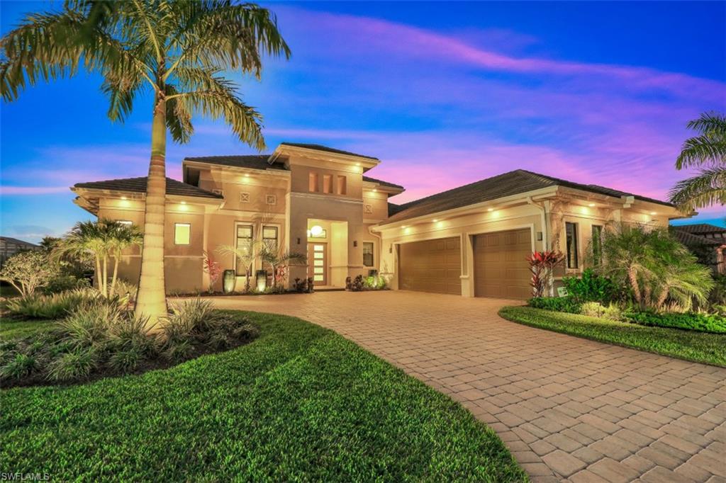 Luxurious & sophisticated, this is the Esplanade Estate home you have been waiting for! Extensively upgraded, this exceptional home is being offered turnkey, with high end furnishings both inside & out & is ready for the new owner to immediately live the ultimate tropical lifestyle.  Completed by Stock in 2019, the 4 bed+den/4.5 bath home on an oversized lot, features an open plan w/clean contemporary lines, accented by long southwest views.  The stunning outdoor area rivals any 5 star resort & includes a pool w/ cascading water & fountain, multiple entertaining areas, including an elevated lounge deck w/ electric pergola, fire feature & outdoor kitchen-all beautifully framed by extensive outdoor lighting.  Some of the many other owner appointed upgrades include impact windows & doors, electric shutters, 11 zone indoor/outdoor Sonos system, upgraded appliances, electrics, custom light fixtures & wall finishes.  The air-conditioned garage is a car enthusiast’s dream with water resistant cabinetry & Swisstrax floor covering. The home comes with golf membership & lawn care, plus all the wonderful Esplanade lifestyle amenities such as dining, fitness, spa, pickleball, & more.