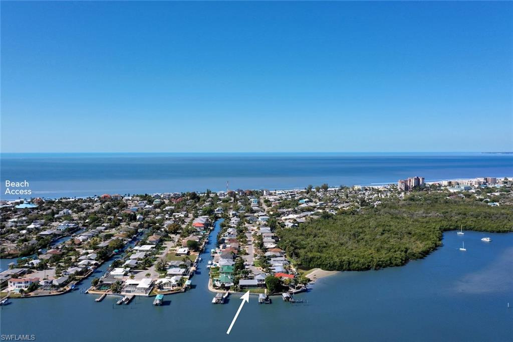 Imagine you are standing on the boat dock in the backyard of this handsome and stylish home, a panoramic sunrise view over the open bay of an aquatic preserve, and moments from the Gulf of Mexico. Take the boat for a spin or kayak the Mantanzas Pass trails. Stay home, relax and swim in your sparkling pool while grilling on the patio. Ride bikes to a restaurant on the beach for a sunset dinner. Entertaining guests will be a pleasure. Spacious floor plan, open kitchen and 3 bedrooms en suite w/freshly updated, spa inspired bathrooms. Situated at the end of a cul de sac in a quiet boating community, 10k lb boat lift, large composite deck. Low-maintenance landscaping and freshly painted exterior. Metal roof & impact-resistant windows/sliders offer additional security during stormy weather. Oversized 2 car garage w/ plenty of storage. Private Elevator. Desirable mid-island location w/ nearby beach access, shopping, dining, recreation & emergency services. Quick drive to airport & hospitals. Schedule your appointment soon!