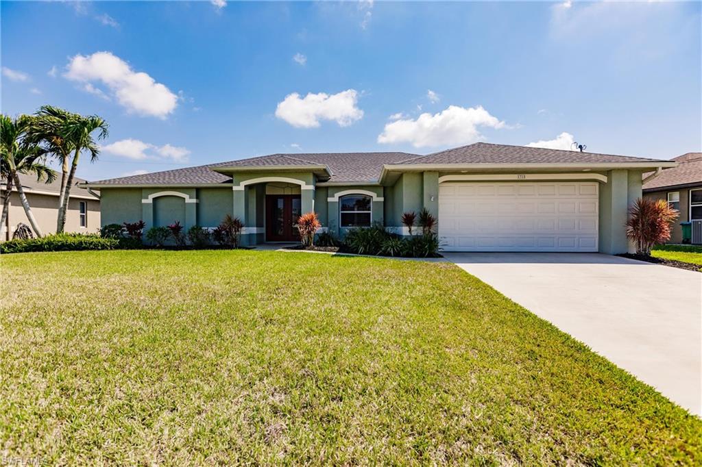 This home is gorgeous inside and out!  The wide open great room is the heart of the home with vaulted ceilings, beautiful Italian Wood Plank Porcelain tile floors, fresh paint, gorgeous art niches and pot shelves. The Remodeled kitchen is stunning with top of the line 42" white cabinets with grey wash accents, above cabinet and under counter lighting, deep pull out drawers for pots and pans, easy close drawers and hinges, pull out spice racks and stunning upgraded granite counters.  There's even a full wall Pantry in a coordinated cabinet color that really makes a custom statement in the kitchen.  All the GE appliances are Stainless Steel with a self-cleaning convection oven, built-in microwave, dishwasher with stainless interior, and upgraded refrigerator.   The owner's suite is on the opposite side of the home from the guest bedrooms and there is a wonderful office with double doors off the entry. All the windows have plantation shutters and all bedrooms have walk in closets with built-in organizers.  The tropical exterior features a new roof, new pool cage, heated pool and huge covered lanai. The backyard faces south which allows for a shaded patio and sunlit pool all day long.
