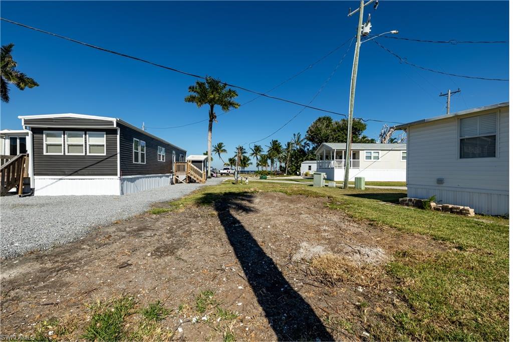 Discover your dream retreat at 16978 Captains Dr, Bokeelia, FL, in the vibrant 55+ Co-Op community of Cap-N-MAC'S. Nestled on the serene north end of Pine Island, this charming community boasts 31 units with exceptional amenities. Enjoy exclusive access to a spacious common area on Charlotte Harbor, perfect for taking in the  breathtaking sunsets. Fishing enthusiasts will love the private 407' pier, while boating enthusasts can take advantage of the convenient boat ramp. Plus, boat slips on the tranquil back bay are available for rent on a first-come, first-served basis. Experience the tranquil island lifestyle you've always dreamed of!