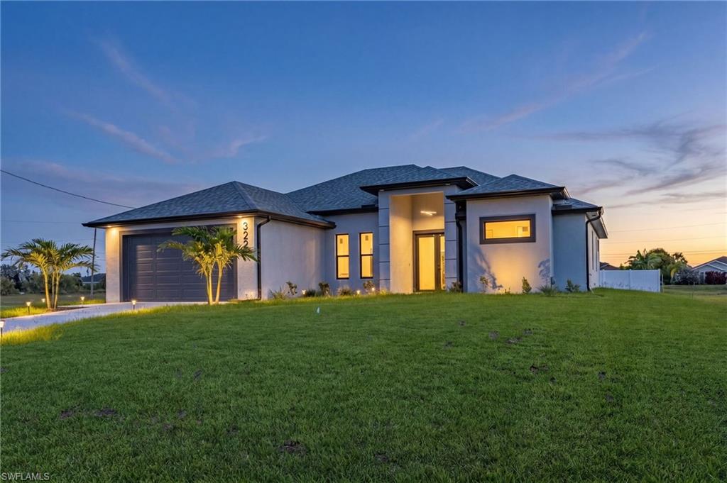 Welcome to your dream home in Cape Coral! This stunning single family home boasts 3 bedrooms, 3 bathrooms, and a 2 car garage, perfect for a growing family or those who love to entertain. The office space provides a quiet retreat for working from home or studying. The kitchen features quartz counters, stainless steel appliances, and 42" cabinets, making it a chef's paradise. The tile flooring throughout the home adds a touch of elegance.High ceilings and impact windows and doors create a bright and airy atmosphere, while LED lights and ceiling fans add a modern touch.The master bathroom is a true oasis with a large shower, and quartz countertops. The walking closets with custom organizers ensures that your wardrobe stays organized and clutter-free.Step outside to the tile lanai and enjoy the Florida sunshine in your private backyard with a sprinkler system for easy maintenance. This new construction home has everything you could want and more, making it the perfect place to call home in Cape Coral. Don't miss out on this opportunity to live in luxury and comfort! *one or more pictures are virtually staged. Seller concessions available!!!