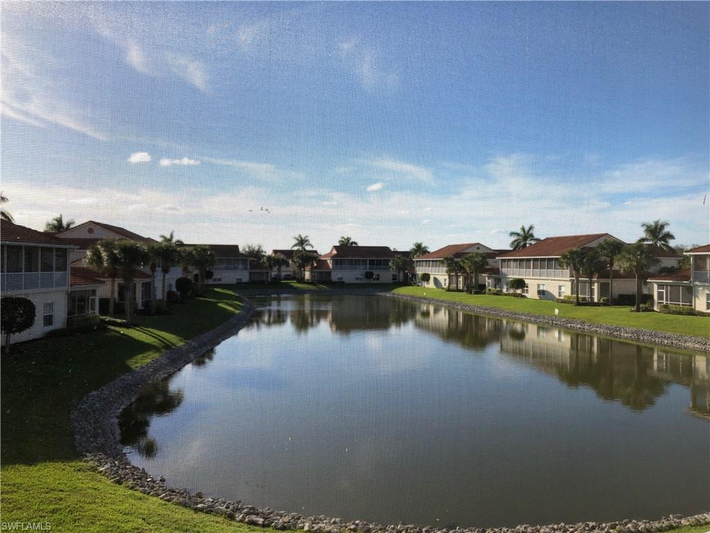 Watch beautiful sunsets from your extra-large Lanai overlooking a lake at this beautiful 2 bedroom,2 bath, open plan Condominium. This unit has vaulted ceiling, large kitchen, breakfast room, smooth-top range, extra large lanai, large master bedroom with huge closet. Lots of space with 1400 sqft. also comes with a attach garage with storage. Orchid Cove has its own clubhouse with activities, large pool and tennis courts. This property is a must see. Fire station, marina with docks available, near by. Just 15 miles to Marco Island, 20 miles to downtown Naples for shopping, restaurants and attractions. This condo has everything beauty and convenience.