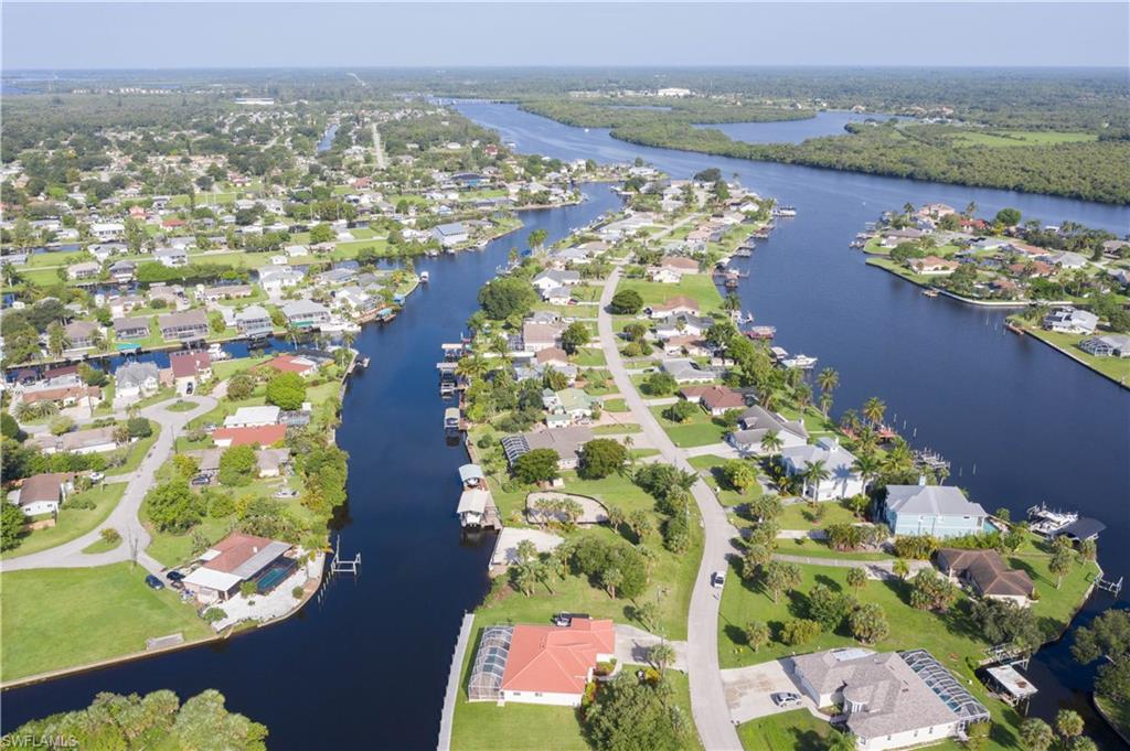 BEAUTIFUL GULF ACCESS lot on INTERSECTING CANAL just minutes to the RIVER, with NO BRIDGES!!  BUILD YOUR FLORIDA DREAM HOME! This lot is located west of the Franklin Locks, SO NO LOCKS OR LIFTS TO DEAL WITH. The seller has a seawall permit that he never implemented and it doesnt expire for 5 years. Close to Shopping, and I75, airport and BOOMING Downtown Ft Myers! Lateral connection for water and sewer is on adjacent lot.
