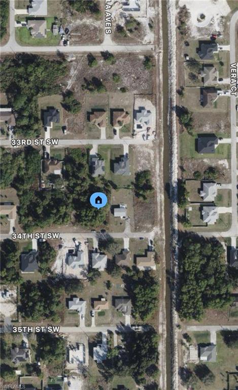 Paved road with electric at the curb next to a brand new home. Quiet dead end street. Perfect vacant lot with easy access to the center of Lehigh Acres and close to Fort Myers for access to I-75. Surrounded by new construction homes. Hablo Español.