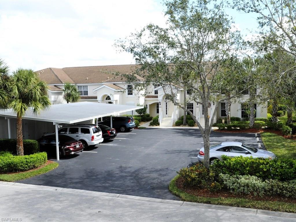 This first floor condo has been totally updated with new wood floors, on-trend gray decor, stainless appliances, granite, new lighting & fixtures, neutral tile floors in bathrooms & more. Upgrades include luxurious mill work, including an extension on the upper cabinets, wide crown molding & baseboards. The Master en-suite bathroom has new double bowl granite counter. New air handler with 2 year transferable maintenance agreement.  Serene lanai has a peaceful, private view overlooking the lake. New WiFi remote lock and ring doorbell. Located near the neighborhood pool and just down from the south pool. The recently remodeled clubhouse has dining facilities, bar, pool and cabana.  The amenity center has a workout facility, pro shop and business area.  Your social membership offers tennis and golf with 3 day tee-times.  The 24 hour manned gated entry assures your guests are treated like royalty upon arrival.  You will have the most beautiful move-in ready condo without a thing to do but enjoy all the amenities that Colonial Country Club has to offer. You will not find another community that will offer you what Colonial has to offer at the price.