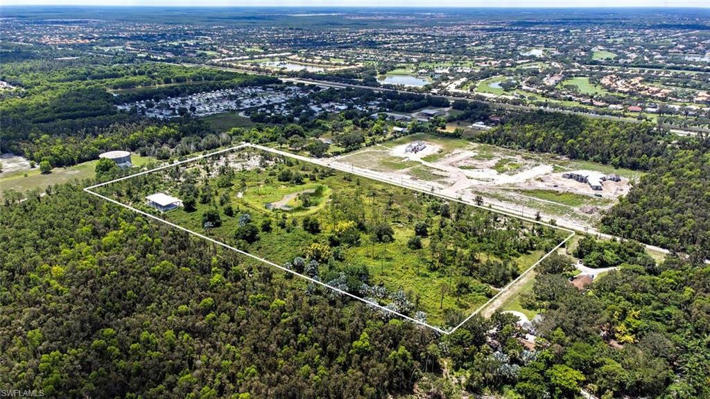 Fully fenced and comprised of nearly 20 acres, this offering presents incredible potential for estate residential, religious establishment development, agricultural / organics, and equestrian opportunities. In 2019 Lee County Zoning Minimum Use Determination allows one home per each of the five parcels. SFWMD (Permit #36-106162-P) determined the site as uplands with a small .66 acre pond.  Additional features include a 50' x 100' steel building with concrete slab, two newly-drilled 6" irrigation wells located on the east and west side of the pond increasing water accessibility, as well as 1320' of Snell Lane frontage with three added entrances.  The property is also ideally nestled within a mere minutes' drive to I75, Publix, and Riptide Brewery, as well as the new upcoming Midtown at Bonita project which will host numerous retail and office spaces, restaurants, and hotel.  Located in the DRGR and has restrictions based on that designation.  Formal Wetlands Determination, Lee County Minimum Use Determination and SFWMD Water Use Permit are on file. Eighteen Miles to Downtown Naples and 7 Miles to: Bonita Bay, Bonita Beach Park and Barefoot Beach.