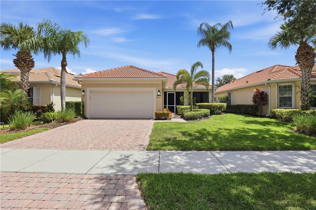 Beautifully maintained 2-bedroom plus den, 2-bath pool home with outstanding curb appeal, lush tropical landscaping, a paver driveway, and an inviting screened entry. Inside, you'll find warm wood flooring in the bedrooms and large diagonal-laid tile throughout the main living areas, creating an elegant and timeless look. The light-filled split-bedroom floor plan offers spacious living areas designed for both everyday comfort and effortless entertaining. Step outside to your own private screened pool and lanai, the perfect setting for morning coffee, outdoor dining, or relaxing in the Florida sunshine. Pride of ownership is evident throughout, making this home truly move-in ready. Residents enjoy an exceptional resort-style lifestyle with outstanding community amenities, including a beautiful clubhouse with restaurant, resort-style and lap pools, fitness center, tennis, pickleball, bocce, basketball, library, hobby and community rooms, beauty salon, scenic walking and biking paths, playground, vehicle wash area, and a full calendar of social activities. This home offers the perfect combination of comfort, style, privacy, and an active Florida lifestyle.