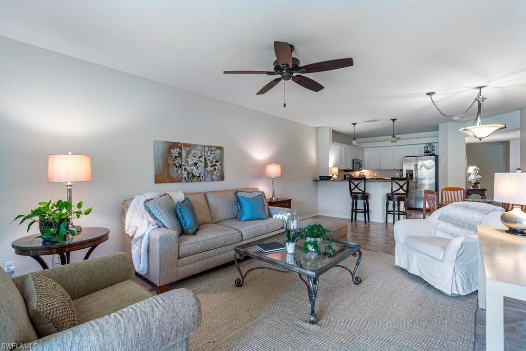 C.17526 - It's time to enjoy your Florida lifestyle in this beautifully Updated 1st floor condo nestled within the amenity rich community of Lighthouse Bay. The 1st floor condo looks out at amazing Sunset and Lake Views from the tiled and private lanai with no buildings across the way! The quality features of this home include 20" Tiled Floors, Granite Kitchen Countertops and Stainless Steel Appliances, beautiful Light Fixtures, 2018 AC, 2015 Hot Water Heater, neutral palette with a GARAGE!  Great open concept living with plenty of storage.  New Roofs 2020.  Lighthouse Bay offers a resort style pool with rock waterfall, spa & sauna, a screened Olympic-sized lap pool, three cabana pools, a freshwater beach, a boat house with viewing deck and paddle boats, canoes and fishing boats to enjoy the stocked lakes, active play on the tennis, pickle ball and bocce courts, fitness room, three miles of walking paths.  On Site Property Management Office & Maintenance Staff and an Amenities Director to keep things active. An optional Private Beach Club Membership is available for residents.  Close to Everything SWFL has to offer!