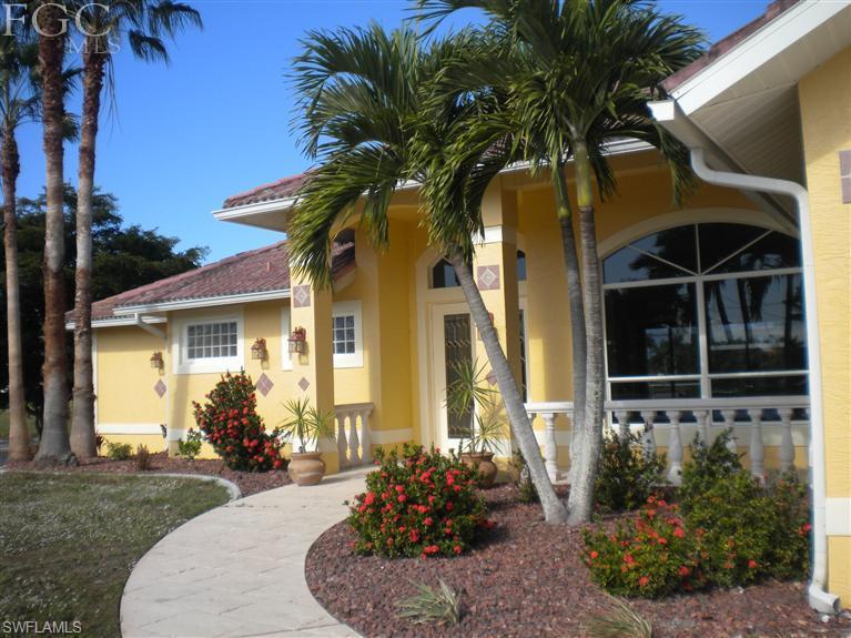 Don't Wait To Build! This One Is Built For Entertaining Inside And Out. Model Like Pool Home In The SW On An Oversized Point Gulf Access Lot With Paid Assessments. There Is Over 200' Of Waterfront! This Home Has A NW Exposure On Wide Intersecting Canals. Beautiful Open Concept, Tiled On A Diagonal And Carpeted Bedrooms. A Brand New Magazine Ready Kitchen With A Granite Counter Island And Sink, Heated Negative Edge Pool And Spa. The Stamped Concrete Screened Pool Area Is 1,400 SF. This Home Boasts 4 Large Bedrooms. A Large Master Retreat Which Could Be A Home Office Or Den As Well. Both Have Access To The Outdoors. This Home Has Over 2,600 SF Of Living Area. Wait Until You See The Enormous Laundry Room With All The Cabinetry And Counter Space, Every Woman's Dream and then some.  Picture Perfect Inside & Out! All The Finishing Touches! New Double Entry Front Doors, Fresh Paint, In And Out And New Carpet In Spare Bedrooms. Great Area, Great Street And Great Neighbors. Look Compare And You Will Be Back. Don't Miss This One