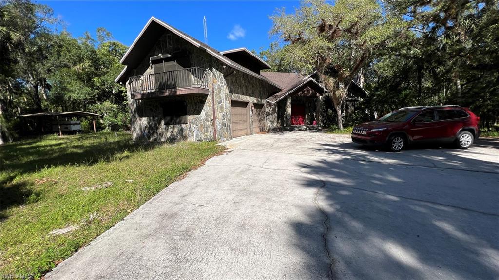 LOOKING FOR TOTAL PRIVACY LOOK AT THIS PROPERTY. 18.69 ACRES OF LAND CONSISITNG OF 3 PARCELS, LOCATED ON TRAFFORD OAKS, HOUSE SITS ON 8 ACRES, PARCEL BEHIND THE PROPERTY CONSIST OF 5 ACRES, PARCEL ACROSS THE STREET 5.69 ACRES  TO THE EAST YOU WILL FIND THE 2,512 ACRES "PEPPER RANCH PRESERVE AND OTHER STATE-OWN CONSERVATION LAND, TWO STORY HOUSE 5 BEDROOMS  4 1/2 BATH, SPACIOUS LIVING ROOM WITH A CHIMNEY, FORMAL DINNING ROOM, KITCHEN AND BREAKFAST AREA, IN THE FAMILY ROOM YOU WILL FIND ANOTHER CHIMNEY, SECOND FLOOR IMPRESIVE SIZE PRINCIPAL BEDROOM WITH ACCESS TO OUTSIDE BALCONY, LOTS OF CLOSET SPACE THROUGH OUT THE HOUSE. BEAUTIFUL WOOD WAS USE TO DECORATE WALLS, ALL DOORS ARE SOLID WOOD, THE EXTERIOR IS COVERED WITH DECORATIVE STONE. ATTACHED 2 CAR GARAGE, HUGE CONCRETE BLOCK DETACHED GARAGE TOTAL OF 3,268 SQ FT WORKSHOP WITH DOUBLE DOORS AND SIDE DOORS TOTAL OF 1,536 SQ FT, CAT GENERATOR. NEW ROOF 2022.  THIS IS A MUST SEE.