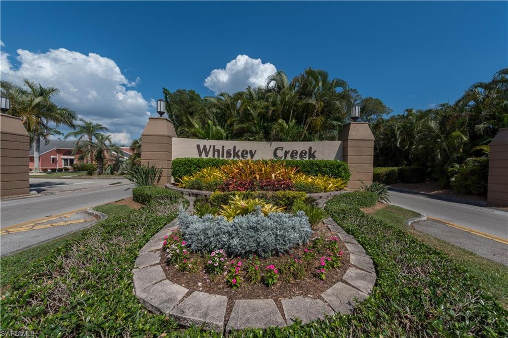 Fantastic villa with attached garage in this duplex style condo. Whiskey Creek is a much sought after South Fort Myers location. Share your amenities with just 24 unit owners in this unique 55+ community. Offering 1600sf of living area.  Very large bedrooms. Large bonus room off living room for den/office/craft room. The kitchen features newly redone cabinets and both bathrooms have been tastefully updated. Hurricane impact windows and shutter. This area was not impacted with flooding from Hurricane Ian.  Peaceful landscaped view from back and just steps to the heated pool. Maintenance free lifestyle! Get in your golf cart and head to Whiskey Creek Country Club just a few blocks away. Restaurant, golf course, card clubs, social activities and more. Join the club or pay as you play.  Walking and bike paths throughout community. Close to beaches, restaurants, shopping, Twins and Red Socks spring training, Barbara B Man Performing Arts Center, Airport... Location, location, location!
