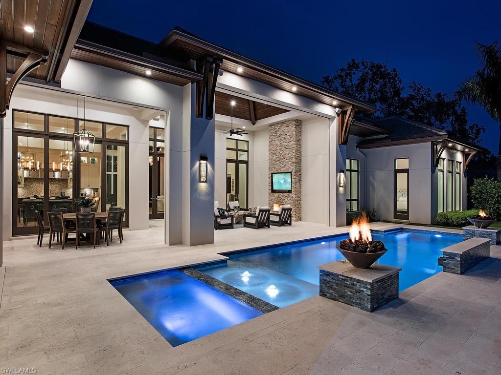 This spectacular custom residence built by KKG and drawn by Falcon Design, Inc. is the recipient of two Sand Dollar Awards, Best Overall Design and Best Kitchen. It offers 4 bedrooms, study, cabana (optional fifth bedroom), and an incredible outdoor living environment on an oversized lot with western exposure. Stunning floor-to ceiling windows and doors allow for natural light with Legno Bastone wide-plank flooring and expert craftsmanship throughout. Beautifully appointed chef's kitchen with crystallo island-top and taj mahal adorning the perimeter, butler's pantry, and custom wine cellar. Lighting, sound, pool, etc. are easily controlled via the Elan Smart Home System. Built-in shades for all window openings as well. Gracious master suite offers spacious his and her closets, stunning bath with his and her water closets. Fantastic porte cochere designed motor court with 3 stalls that can accommodate lifts for the car enthusiast. Located in Pelican Bay, just moments from the private beach club, golf clubhouse and tennis courts. This home shows as new, and offers that next level of quality.