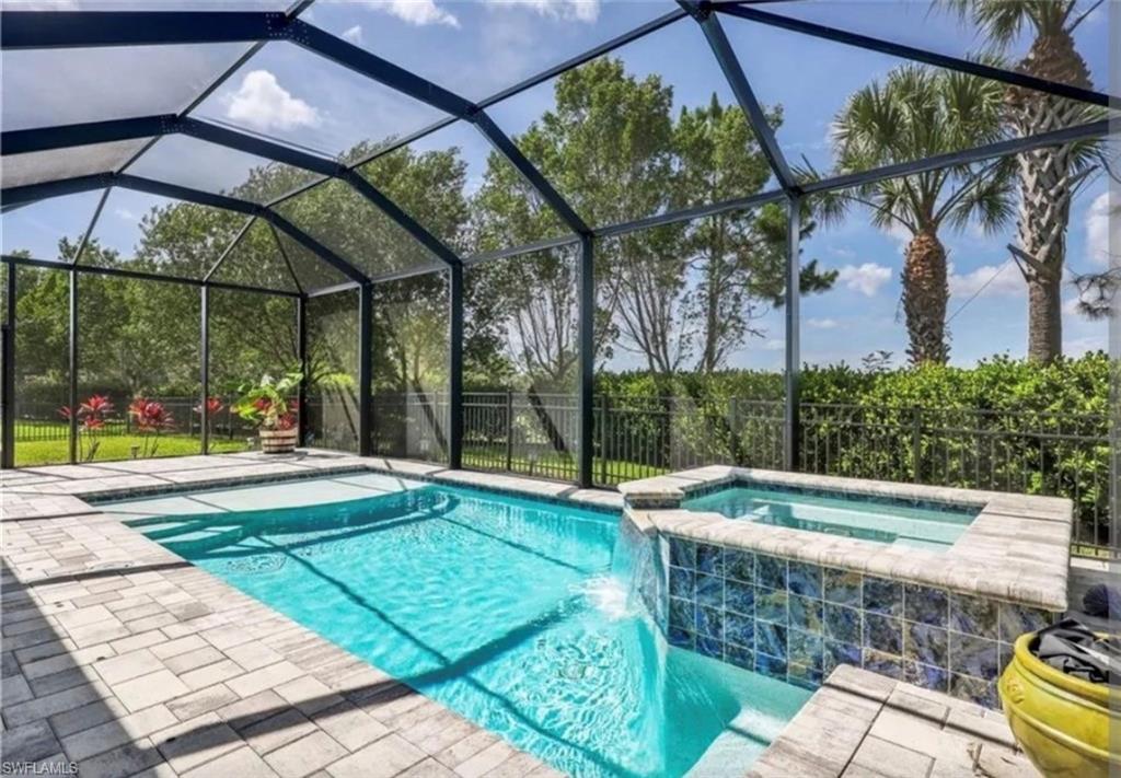 PRICE ADJUSTED! SELLER IS OFFERING $10,000 TOWARD A BUYER’S INTEREST RATE BUYDOWN OR CLOSING COST CREDIT! Some homes have a nice backyard.. this one has THE BACKYARD. Set on one of the best lots in the community, this Ashbury model with HURRICANE GLASS THROUGHOUT gives you the space, privacy, and view buyers hope for but rarely find. The extra-wide fenced backyard is framed by 7-foot privacy hedges on both sides, with extra green space that makes the property feel open, usable, and private. It is perfect for pets, kids, entertaining, or anyone who wants room to breathe without staring straight into a neighbor’s lanai. Behind the home, the view opens to the CREW sanctuary, approximately 60,000 acres of protected land. That means privacy, nature, and a peaceful backdrop that cannot be duplicated by another builder release. You also have easy access to hiking and biking right from your backyard, making this lot one of the true standouts in the neighborhood. The outdoor living space is just as good as the setting. Enjoy your private pool and spa, a covered lanai with cedar plank ceiling detail, an outdoor half bath, and plenty of yard space on both sides of the home. This is the kind of backyard people move to Florida for. Inside, the home is bright, spacious, and beautifully finished with a warm coastal-farmhouse feel with the wood beams and hand crafted shiplap wall. Built just 6 years ago and heavily upgraded from the start, it features 4 bedrooms plus a den, 3.5 bathrooms, and hurricane glass throughout. From the moment you pull up, the home feels fresh and inviting with BRAND NEW LANDSCAPING right out front and thoroughly cleaned roof, gutters, soffit, fascia, and windows. The community offers a clubhouse, fitness center, resort-style pool with beach entry, lap lanes, sundeck, poolside tiki hut, lounge areas, white sand beach with hammocks, social room with kitchen, nature trail, dog parks, fishing, biking, tennis, bocce, and pickleball. And the location keeps getting better, with the highly anticipated Midtown Bonita luxury shopping and dining area just minutes away. Homes can be upgraded. Lots like this cannot be recreated. Watch the CINEMATIC TOUR and you will see exactly why this one is special.
