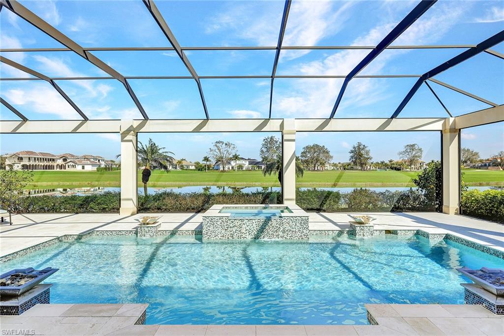 Immediate golf available! Live the serenity and elegance of Talis Park: A west of I-75 Naples 5-star, luxury-designed Norman/Dye golf and tennis resort community. This custom 2016-built contemporary pool/spa home offers 7400+ square feet of luxury indoor and outdoor living including the expansive pool/spa deck, 3-car A/C garage, plus whole-house generator, and private golf and lake views. The elegant foyer reveals a stunning living room with 16-foot ceilings, two dining areas, gourmet chef's kitchen, two islands and wet bar, all offering generous storage and seating. The floor plan flows spaciously from room to room, featuring impact windows and pocket sliders opening to the pool/spa deck with ample seating, outdoor kitchen, fireplace and electric hurricane shades. Experience superb Talis Park dining/entertainment venues, resort/lap pools, tennis, pickleball, bocce, state-of-the-art fitness/wellness/spa, beach shuttle, dog park and exquisite landscaping. Ranked by Golf Digest as one of Florida’s top 20 courses with a total course renovation completed in 2023, Talis Park is one of the nation’s premier golf experiences, symbolizing the rare beauty and quality of the entire community.