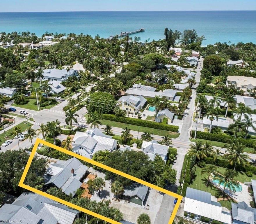 Opportunity in the heart of iconic Olde Naples! Now with the bonus of your own private Island!
As rare as it is to find a well-preserved historic home in Olde Naples, it is even more rare to find one that has been in the hands of the same family for 5 generations!. Once coined “Fisherman’s Lodge”, this magnificent 3 bedroom 2 bath home with guest house is perfectly situated on .23 acres of lush landscaping with a large drive way for added ease of access for main home & guest house. Inside you’ll be delighted to find softly worn, genuine hardwood floors, original fireplace, and an abundance of windows filling the home with natural light and tropical breezes. Enjoy the very best of Olde Naples without ever having to get in your car! Steps away from 3rd Street South, one block to Naples Pier and the Gulf of Mexico’s most beautiful beaches and sunsets. Seller will include a private lot on Sea Oat Island -Located just south of southern tip of Keewaydin Island, on Sea Oat Island,  No need to travel to the Caribbean, just minutes by boat from Naples.
