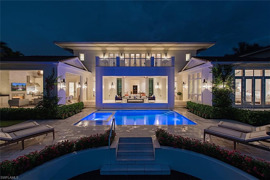 Truly an exceptional new construction home offering wide water westerly exposed sunset views within Aqualane Shores.  This VIV home is now without question the next best luxury waterfront opportunity in Naples and presents a combination of quality, location, and value without rival.  Residence includes 5 en-suite bedrooms plus a study, open great room floor plan with first floor master, 4 car garage, and is situated just a short stroll to 3rd Street amenities and Naples finest beaches.  Some of the interior features of this clean lined and coastally inspired home include full concrete construction, rich walnut wood flooring, fully integrated Savant home automation with Sonos, and an extraordinary gourmet kitchen complete with butler’s pantry.  The waterfront outdoor living area offers a complete and opulent outdoor kitchen secured by automated screens/shutters, fire place, heated pool/spa, and an 85 foot Ipe dock.