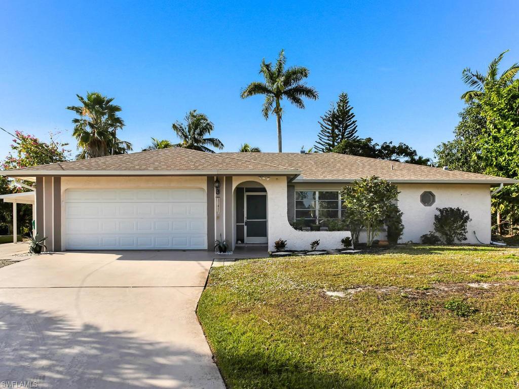 Come visit this 3-bedroom 2 bathroom 1,559 sqft pool home located in Golden Gate City. Perfectly placed on one of the neighborhood’s nicest lots, this home backs up to a lake-like canal, offering beautiful views. Plenty of gorgeous palm trees create privacy and lots of shade for the large deck. The home FEATURES: new roof in 2014, new septic system in 2016/2017, all new flooring in main living areas, new kitchen, new appliances in 2017, new water heater, updated guest bath, new carport worth $10,000.  This home is a must see! Located near Rita Eaton Park which is great for outdoor sports and family fun. Schedule your showing today to see all that this hidden gem has to offer!