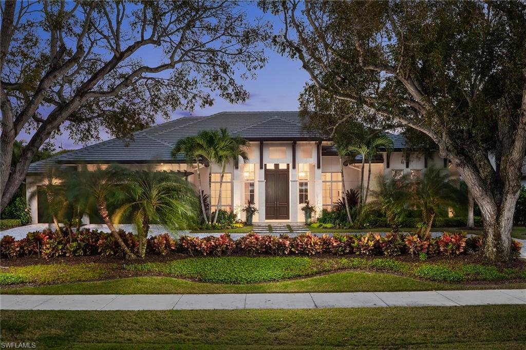 Tucked away on Crayton Road, this spectacular residence offers West Indies-styled architecture, sizable square footage and one-level living. Penned by Falcon Design and built by the ever-popular Knauf-Koenig Group, this offering separates itself from all others with an unrivaled combination of quality, lot size and proximity to the beach. This well-designed floor plan reflects today’s needs with an open-concept great room, towering vaulted ceilings and banks of sliders that open onto the outdoor pool area, ultimately letting the outdoors in. Entertainer’s dream kitchen with massive marble waterfall-edge island, breakfast bar and top-of-the-line appliances including refrigerated drawers, wine storage, steam oven and Wolf gas cooktop. Spacious master suite with enormous custom closets and marble bath boasts dual water closets, a large walk-in shower with multiple heads and a soaking tub. The outdoor area offers multiple entertaining areas with a fireplace, summer kitchen, fire bowls, motorized screens and shutters.