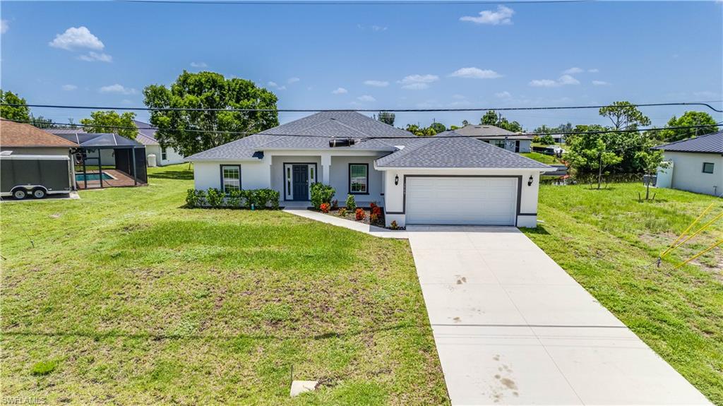 Incredible, like-new waterfront home situated on a freshwater canal with desirable eastern exposure! Enjoy peaceful canal views and the Florida lifestyle from your own backyard.  
This thoughtfully designed home features a spacious primary bedroom with a private bath, a guest en-suite bedroom, two additional guest bedrooms, and a full guest bath. The bright, open-concept floor plan is filled with natural light and neutral finishes, providing the perfect canvas for your personal style.
The beautifully appointed kitchen features a French-door drawer refrigerator, ample cabinetry, and a large island that's perfect for entertaining, casual dining, or everyday living.  Best of all, this home is located in an area where flood insurance is not currently required by most lenders. Don't miss this opportunity to own your own waterfront paradise!