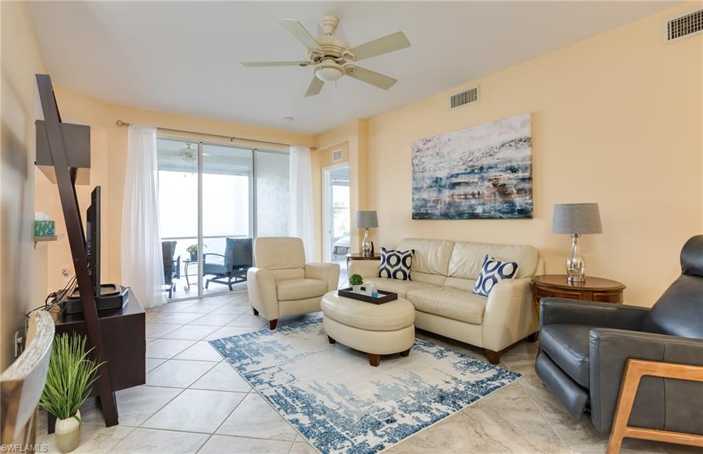 Beautiful 1st floor condo w/ two bedrooms, a den & a 1 car garage!! From the moment you enter.. Gorgeous updated tile flows seamlessly throughout the whole house and lanai for easy maintenance. Stunning updated master bath w/ granite, seamless shower doors & updated tiled shower. Nicely painted in soft tones that welcome the Florida sunshine and updated Stainless Steel Appliance Package!! Sit back on your relaxing lanai w/ nature surrounding views. You're sure to have peace of mind w/ updated accordion shutters on the windows & electric roll downs on the lanai!! Wait.. There's more.. This well decorated & furnished home is being offered turnkey!! Colonial Country Club offers a wide array of amenities including Tennis, Bocce Ball, Pickle Ball, multiple pools, a huge clubhouse w/ fine dining and casual sports pub, walking trails and an exercise facility with tons of classes to choose from along w/ low Social Membership fees and pay as you play golf. Conveniently located close to shopping, dining, entertainment and an International Airport. Resort Style living to it's finest, move in ready and ready for you to call it home!! *exterior photos similar (exterior currently being painted).