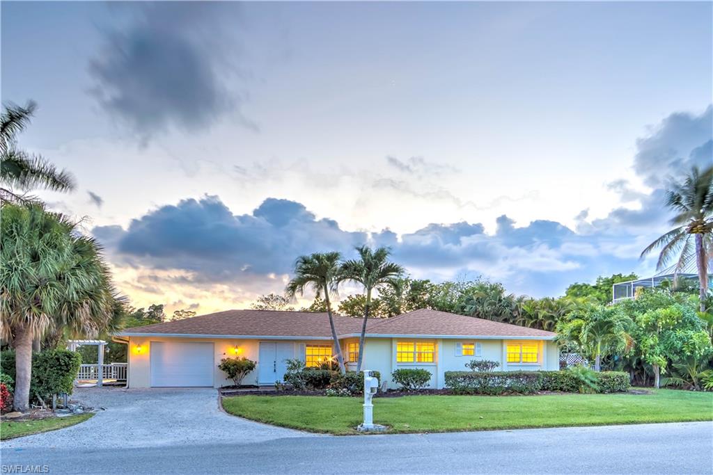 Calling all boaters! This property is a boaters dream located in desirable Sanibel Isles! Gorgeous 3 Bedroom, 2 Bath home is situated in a private setting on deep water, direct access canal. Home has been recently updated and features 18" neutral tile throughout, kitchen features beautiful white cabinets, solid surface counters and newer stainless steel appliances. Kitchen and breakfast bar flows into large great room which opens to a huge deck and outdoor living space. Expansive composite wood deck runs the entire length of the home, and looks out on canal, dock, natural vegetation, wildlife and sea life (cue the dolphins and manatees!). As if that wasn't enough- western exposure allows you to take in Sanibel's magical sunsets from your private deck. All of this, in one of the few Sanibel neighborhoods that allows you sea walled, deep water, direct boat to bay access in minutes. Newer roof, all of the following items were replaced in the last 6 years, Sea Wall, AC and all duct work, H20 Heater, Water Filtration System, energy efficient honeycomb cellular shades on all windows (keep cool in and heat out) and Washer Dryer.