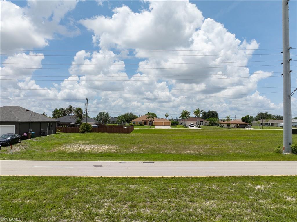 Build your Florida dream home on this oversized residential lot in a growing area of Cape Coral! With extra space compared to many standard lots, this property offers plenty of room for a larger home, a pool, outdoor living areas, and more. Located in a desirable neighborhood with convenient access to shopping, dining, schools, parks, and major roadways, this lot provides the perfect balance of privacy and accessibility. Whether you’re ready to build now or looking to invest in one of Southwest Florida’s fastest-growing communities, this oversized parcel presents an excellent opportunity. Don’t miss your chance to secure a piece of paradise in Cape Coral!