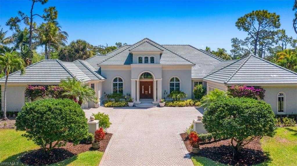 Sited on one of Grey Oaks most beautiful streets and overlooking number 14 of the Pine course, this sprawling traditional home has an IMMEDIATE GOLF MEMBERSHIP AVAILABLE. NEW in 2020; Roof, AC home unit, garage AC, whole house generator, 500 gallon propane tank and landscape lightiing. Gracious rooms, soaring ceilings and tons of natural light are key features of this beautiful home. A large study and formal dining room flank the spacious foyer. The recently updated kitchen boasts gleaming quartz counters and a large pantry and flows seamlessly into the casual dining area wrapped in glass and the family room with fireplace. Walls of glass disappear connecting the family room to the massive covered lanai and another large fireplace. The large main bedroom has a generous sitting area and large walk-in closets leading to a very bright and sunny main bath with dual sinks, large shower and separate soaking tub. There are two other ample guest bedrooms each en suite with great closet space. A large laundry room and oversized garages accommodating 3 cars and a golf cart complete this offering.