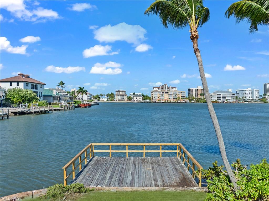 Wide bay views from this exceptional oversized point lot in Vanderbilt Beach! This property represents a trophy investment, the perfect canvas for your forever home with Southwest Exposure for Year-Round Sunsets! Discover a rare opportunity to own in highly sought after Conners community near the Ritz Carlton. Nestled at the end of a serene cul-de-sac, this stunning property boasts an impressive 0.37 acres of premium waterfront bliss featuring an astounding ~191 feet of water frontage. Perfect for boating enthusiasts, offers direct Gulf access, allowing you to be just minutes away from the open waters of the Gulf. Imagine crafting your custom estate on this expansive canvas, with ample space for a stunning residence, a luxurious pool, and generous outdoor living areas all framed by panoramic water views that will leave you in awe. This coveted point lot allows you to moor your boat on the side, preserving your breathtaking wide-open views and ensuring picturesque vistas from every angle!
Enjoy the upscale shopping and dining at Mercato, and the luxurious amenities of The Ritz-Carlton. With no HOA restrictions. Embrace the coastal lifestyle you've always dreamed of make your vision a reality.