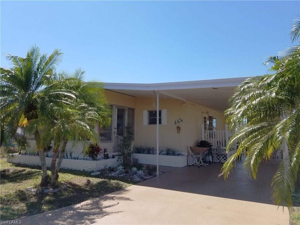 FULLY FURNISHED~~TURNKEY & PRICED to SELL in LAZY DAYS MOBILE VILLAGE! Why spend a lot of $ on your vacation home? LOW HOA fee $135/month! Own this unit AND your LAND while you Enjoy MAINTENANCE-FREE AFFORDABLE LIVING in the Sunshine State in this spacious, WELL-MAINTAINED, double-wide w/large Florida room on a quiet street w/no through traffic. Over 1000 sq. ft. under A/C PLUS storage & laundry area with washer, dryer, and laundry tub. Master BR has 2 closets & easily accommodates King-size bed. Dining room has built-in cabinets. Plumbing is new, & floors have been re-done. Awnings for weather protection. Walk to the pool & enjoy a friendly 55+ Community w/two clubhouses, heated pool, shuffleboard, ponds, parks, mature landscaping, street lights. Low-cost RV & boat storage available on-site! A great place to live year-round or as a 2nd home for warm weather enjoyment! (Exclusions: Flat screen TV in LR; Bicycle; Personal items)