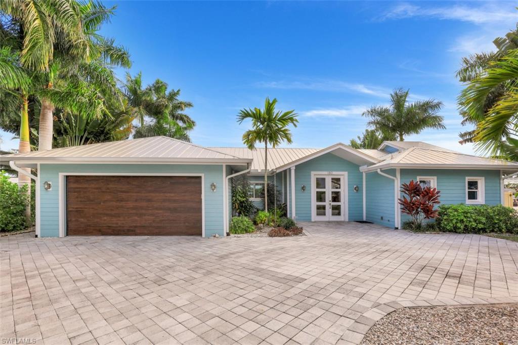 A magnificent home that has it all! Literally steps away from the white sands of Vanderbilt Beach, and close proximity to world class luxury resorts, upscale dining and shopping. Southern exposure, fully furnished, and move-in ready! This masterfully-remodeled waterfront home is bright and airy, with modern coastal and high-end finishing. Exceptional quality throughout this custom built residence with an open floor plan that extends to a spacious outdoor living area with a relaxing pool and spa. Other notable features include a covered private boat dock and storage shed.