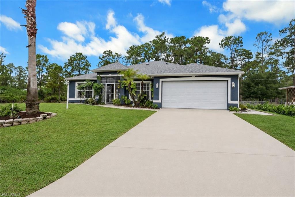 Looking for space, privacy, and room to live the lifestyle you've been dreaming of? Nestled on a generous half-acre lot at the end of a quiet dead-end street, this beautifully maintained home offers the perfect blend of comfort, functionality, and peaceful living. With over 2,000 sqft of living space, this inviting home features soaring vaulted ceilings, a cozy fireplace, and an open, airy feel throughout. With 4 spacious bedrooms plus a den, there's plenty of room for a home office, playroom, guest space, or hobby area to fit your needs. Step outside to the screened lanai and enjoy views of the expansive backyard, complete with a fire pit, perfect for gathering with friends and family under the stars. The oversized lot provides endless possibilities, with plenty of room for pets, outdoor entertaining, a garden, or even your future dream pool. A standout feature is the impressive 25' x 30' detached garage equipped with both 110 and 220 electrical service. Whether you're a car enthusiast, hobbyist, entrepreneur, or simply need extra storage, this versatile space is ideal for a workshop, home gym, recreational vehicles, boats, or all your favorite toys. If you've been searching for a property that offers privacy, flexibility, and room to grow, this is one you won't want to miss. Schedule your private showing today and discover everything this home has to offer!