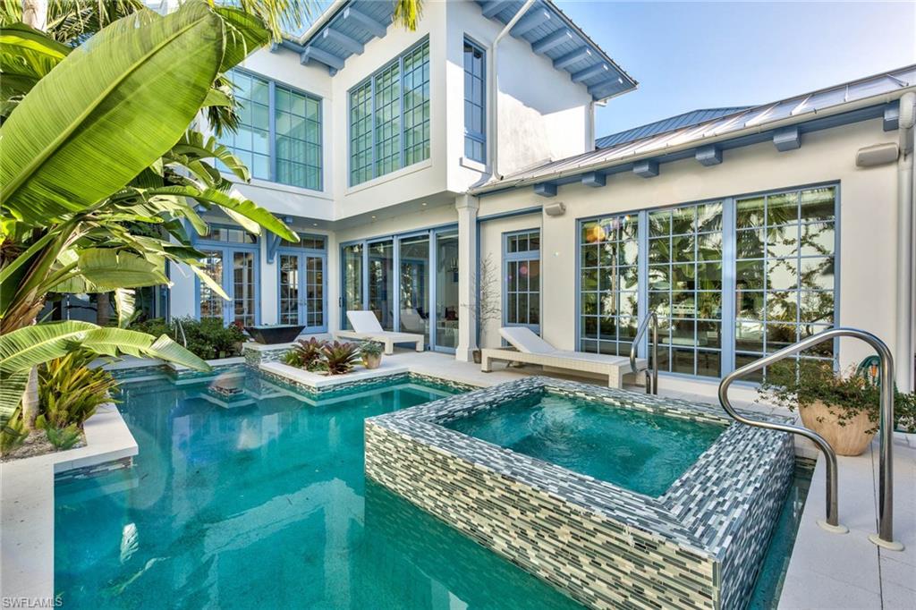 This unique home and property are a "Boaters Dream Come True". Naples finest treasures are within walking distance of the front door. Located a mere One hundred yards from the Naples Boat Club and Naples Bay, one need only stroll 4 short blocks to explore 5th Avenue South's varied shops and restaurants. The nearby Gulf of Mexico beckons with white powder beaches that have longed lured the discerning to Florida's West Coast. This luxurious home ,located in the heart of Olde Naples features 4bedrooms, 4 and a half baths, a two car climate controlled garage and a delightful separate guest house. Tastefully appointed with an open floor plan, the house offers a large kitchen and airy family room that leads to a beautifully landscaped lanai with pool and spa. The exterior is enhanced with an outdoor kitchen and fire pit that compliment the charming poolside courtyard. Interior features include French Oak Wood and stone tile flooring, Miele appliances, wine cooler and insulated hurricane impact windows and doors. This is a Breathtaking Property that will entice prospective buyers...