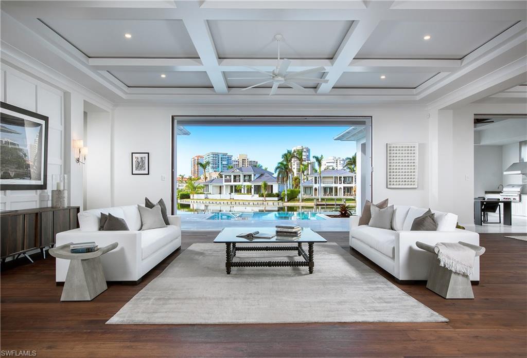 This remarkable new construction home welcomes you with breathtaking bay views and offers over 100 feet of water frontage. Slated for completion at the beginning of 2018, this new construction property presents an expansive open concept great room floor plan and loft style second floor with lounge. Addressing every possible need of the most sophisticated buyers, this property offers a Gourmet kitchen with professional grade 6- burner gas range, large center-island and refrigerated drawers to inspire your inner chef. Generous pocket sliding doors open to the gracious outdoor area with panoramic water views showcasing a negative-edge pool and spa, outdoor kitchen, fire pit, dining and lounging areas, affording the ideal retreat and entertainment area. Owners will also appreciate a full wine room, three car-garage and additional first floor den. This Naples residence is centrally located just moments away from world-class upscale shopping and dining at Waterside Shops and Venetian Village as well as sandy beaches at the private Park Shore Beach access.
