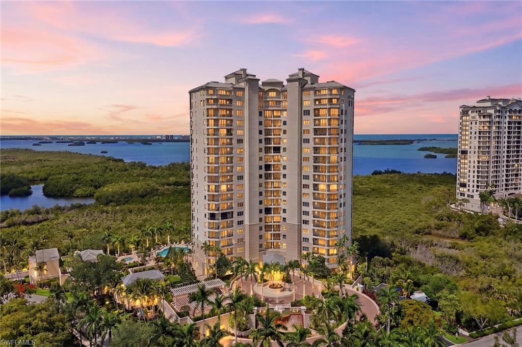Transferable golf membership available. Refined high-rise living awaits in the heart of The Colony, where extensive recent building and residence upgrades elevate style and substance. The impeccably maintained building has undergone significant enhancements, including a new roof (2024), full exterior repaint (2025), refurbished elevators, redesigned pool pavilion with new furnishings, refreshed garage elevator lobbies, upgraded landscaping and ongoing first-floor amenity improvements. Perched on the 15th floor, this exceptional residence captures sweeping views of Estero Bay and the shimmering Gulf of Mexico, creating a breathtaking backdrop from sunrise to sunset. Thoughtfully curated with refined built-ins throughout, the home blends sophistication with effortless comfort. Highlights include a beautifully designed entertainment center in the family room and a dedicated study workspace within one of the guest bedrooms, ideal for working remotely or quiet retreat. The kitchen has been tastefully enhanced with quartz countertops and updated appliances, offering style and functionality for everyday living and entertaining alike. Designed with privacy in mind, the guest bedrooms are thoughtfully separated from the primary suite, providing a tranquil experience for family and visitors. The serene primary suite serves as a private sanctuary, featuring a renovated spa-inspired bath and a custom-designed walk-in closet complete with a center island for added elegance and organization. Expansive sliding glass doors open to a spacious lanai where stunning sunset views over the Gulf create the ideal setting for relaxing evenings and year-round indoor-outdoor living. Ownership includes exclusive membership to The Colony’s private Bay Club, offering waterfront dining and vibrant social amenities reserved solely for residents. Live your best luxury lifestyle with a private island beach, fitness, tennis, pickleball, bocce, canoe and kayak park, and more, all included for no additional fees. Two golf courses offer optional membership opportunities, so please contact the membership directors for pricing and availability. Shopping and dining are available at Coconut Point and Southwest Florida International Airport is a quick 30-minute drive.
