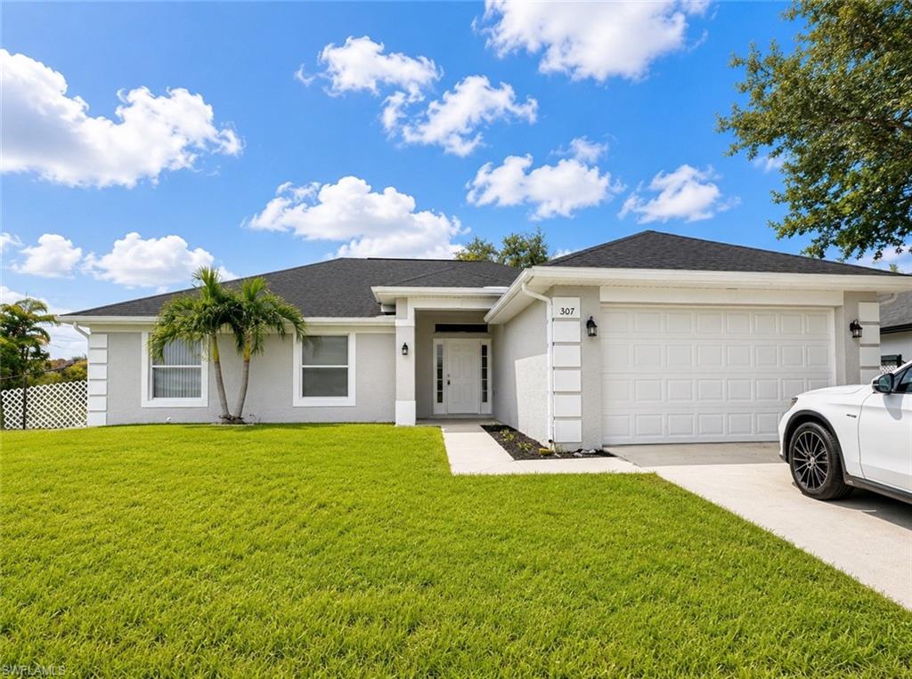 Built in 2005, this 1,252 square foot home has been meticulously updated: it features four spacious bedrooms, two bathrooms, and a large open-concept living, dining, and kitchen area. It also boasts a screened lanai and sits on a 0.23-acre lot. The home has high ceilings, with a new roof and air conditioning installed in 2024, and a brand-new front door. With no carpet, a fenced yard, and a sprinkler system, it is located in a well-populated but peaceful, family-friendly neighborhood, perfect for kids. Just steps away from stores like Sam’s, Walmart, Publix, and with easy access to Pine Island Road. The neighborhood offers city water and sewer, providing maximum convenience. A truly unique, central, and family-oriented gem.
