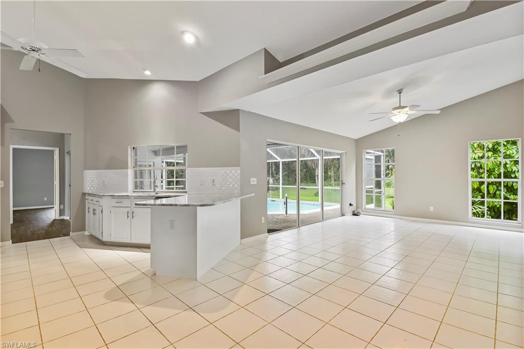 Renovated single family home on 2.5 acres of land! Enjoy being in a peaceful setting surrounded by an "Old Florida" feel with plenty of room for everyone, yet still live close to all of the conveniences of city life. This beautifully updated home is situated in a non-gated neighborhood on a low traffic, dead end road with no HOA fees & little restrictions. Gorgeous renovated kitchen & bath designs with granite countertops, and the kitchen offers lots of cabinet space & top-of-the-line stainless steel appliances. There is NO carpeting in home- tile flooring throughout, lots of natural lighting with large slider systems and transom window, crown molding, plant shelving, French door front entry, cathedral ceiling, and intercom system are just some of the bells & whistles. You will love the amazing outdoor living space that includes an extended rear pool lanai, pool bath, and long under truss sitting area that overlooks a large backyard w/ shed and a wood burning fire pit. Wonderful private setting-surrounded by custom built single family homes that are situated on 2.5-/+ acres, and has easy access to I-75, Ave Maria, and lots of shopping & dining options.
