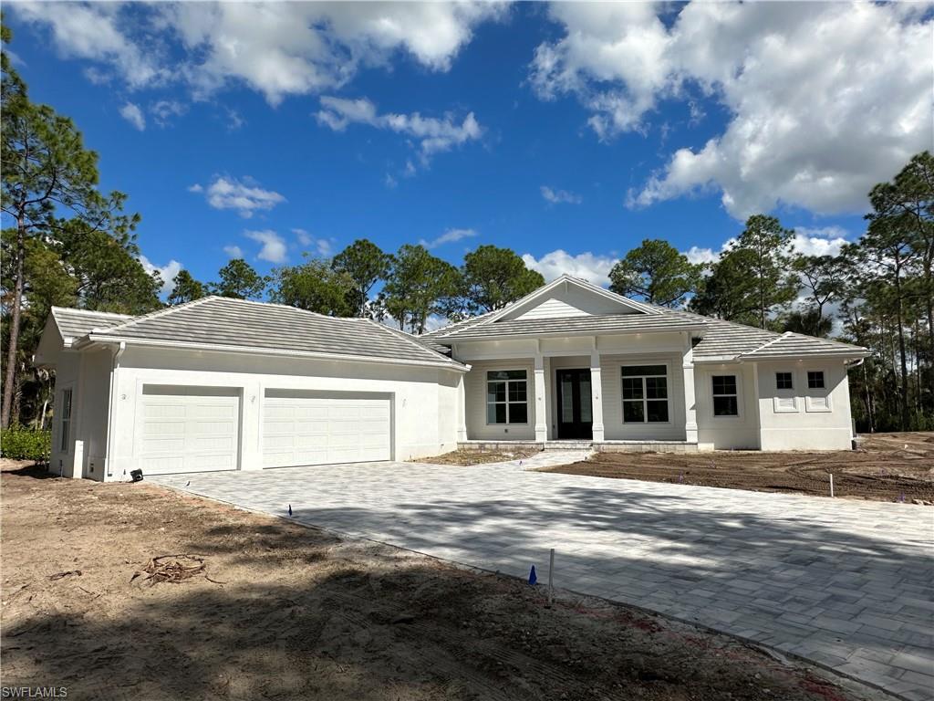 This luxurious new-construction, custom home is situated on 2.27 acres and includes a detached, 8-car garage/workshop and guest house. As you walk through the 10-foot, custom front doors, you are greeted with a coastal-contemporary design which is open and inviting. This 5257sf home has 5 bedrooms, 4 bathrooms, an office, formal dining room and gas-heated pool and spa. The kitchen boasts a large pantry, gas range, and quartz countertops. Floors are gorgeous, oak-wood plank and tile throughout. Covered patio is plumbed for a future summer kitchen.  The accessory structure on property contains a guest house and is a car enthusiast's dream. The 2249sf garage includes a 9-ton, 2-post vehicle lift and parking for 8 vehicles or trailers; while the 14-foot doors allow motorhome access.  The attached 1430sf guest house is complete with a kitchen, great room, master bedroom, guest bedroom, laundry room, and bathroom with luxury-vinyl flooring and quartz countertops throughout. This compound is fenced with PVC and chain-link and has a private entry gate with keypad and remote.   Completion of construction of the main house is expected in January, 2024. Refrigerator in garage does not convey.