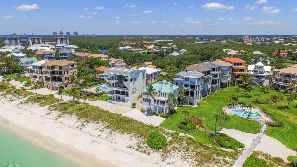 Escape to the beachfront bliss that is Barefoot Beach. Experience jaw dropping views of the sparking Gulf of Mexico. Custom home with Caribbean flair and natural light filled open concept floorplan. Extraordinary 180 degree views from Naples' Park Shore Beach all the way to Sanibel Island from your 4th level roof top deck! Envelop your senses and relax in the warm tropical surroundings of Barefoot Beach. Explore miles of white sandy beach in the ultimate beachfront community.
Barefoot Beach, ranked #1 beach in the continental U.S., is located on 342 acres of natural preserve on a barrier island in the Gulf of Mexico. Imagine yourself barefoot in the sand with a cool drink in your hand!