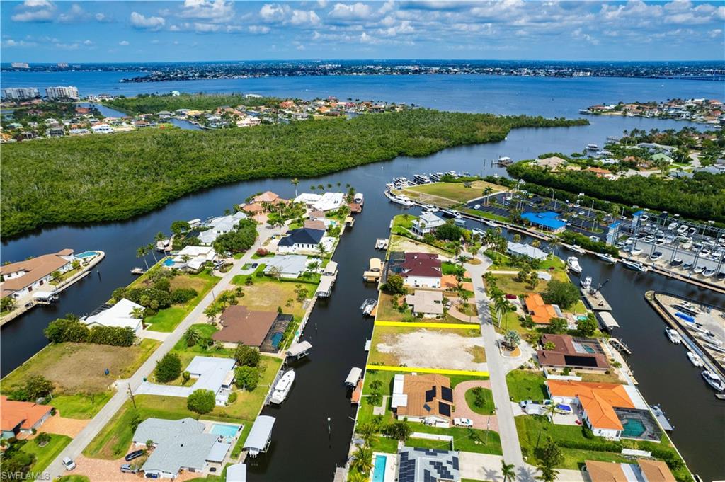 Stunning Deep Water Direct Access Lot in Deep Lagoon Estates! Welcome to an extraordinary opportunity to own a prime waterfront lot in the highly sought-after Deep Lagoon Estates. This expansive homesite offers direct, deep water Gulf access with no bridges, perfect for serious boaters, yacht owners and true water enthusiasts. Enjoy wide water views and ideal southern exposure that bathes your future home in natural light from dawn to dusk. The lot is ready for your vision, complete with an existing seawall and dock-just bring your dream and your preferred custom builder. With plenty of space for a luxurious residence, pool, and all your toys, this property offers the freedom to create a true coastal masterpiece without the constraints of a mandatory HOA. Just minutes from the world-renowned sugar sand beaches of Sanibel and Fort Myers Beach, and conveniently close to upscale dining, boutique shopping, top-tier medical facilities, and all the amenities of coastal Southwest Florida living. Build your legacy in Deep Lagoon Estates, where waterfront living meets limitless potential.