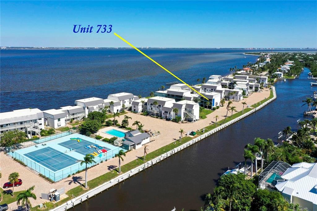 Owner Financing Available - Your Dream Waterfront Retreat Awaits! Stunning Bay & Canal Views from This Top-Floor, Corner 2-Bedroom, 2-Bath Condo Located in one of the most coveted spots at Mariner Point, this spacious top-floor, corner condo offers unparalleled views of the Bay and canal. If you're a boating enthusiast or simply love being close to the water, this is the perfect home for you. With direct access to the Gulf of Mexico beach just moments away, you'll enjoy the best of both worlds — a peaceful sanctuary and endless outdoor adventures. Mariner Point is a boater’s paradise, featuring low dockage fees for owners, making it an ideal to explore the San Carlos Bay and Gulf of Mexico. Spend your days soaking up the sun on the beach or cruising the waters. This condo also offers excellent rental potential. Mariner Point has something for everyone, including two sparkling pools, tennis and pickle ball courts, boat docks, and a fishing pier. Whether you’re here to relax, play, or explore, you'll find it all right outside your door. Already funded $870,000 for new landscaping to be installed. This is more than just a condo; it’s the perfect waterfront lifestyle. OWNER FINANCING AVAILABLE. Don’t miss out on this incredible opportunity!