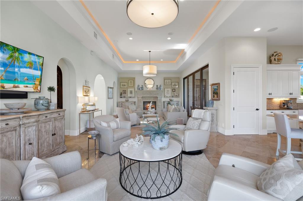 Panoramic, unobstructed views of the golf course, lakes and meandering streams can be enjoyed in this timeless Talis Park residence.  Impeccably maintained and a one of a kind custom floor plan masterfully constructed by WCI.  Perfect for the inspired home chef with two large pantries, natural gas, two dishwashers and an expansive, seamless island. The summer kitchen provides additional entertaining possibilities.  The great room affords multiple seating areas and a gas fireplace. Tranquility awaits in the peaceful primary suite and sitting area.  Three ensuite bedrooms, two half baths (one powder and one in the summer kitchen area), a golf cart garage and two additional garage spaces, honed and filled Travertine tile, electric screens for the summer kitchen and porch and arguably the prettiest place to enjoy sunsets each day!  Located at the end of a quiet cul de sac for additional privacy.  Talis Park offers a busy social calendar, an award winning clubhouse, a recently renovated golf course (current wait list), several dining options, tennis, pickle ball, bocce, two dog parks, a beach runner, spa and workout facilities.