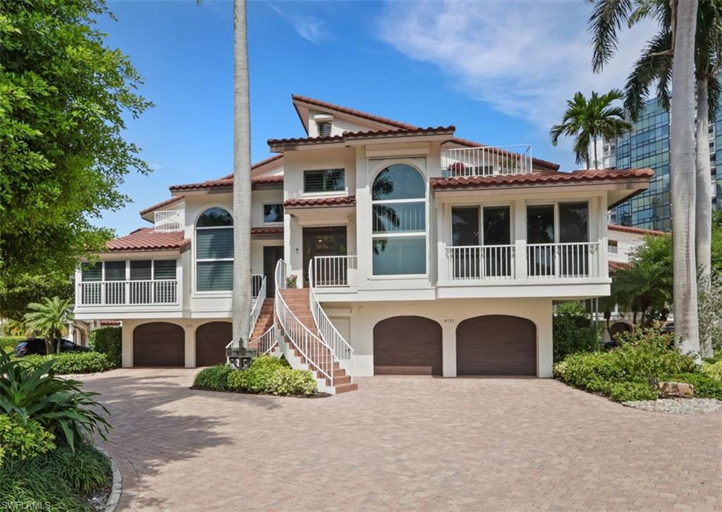 Breathtaking Gulf-front living with bay views! Experience Naples outdoor living in this beautifully updated residence in the exclusive gated enclave of Villa Mare in Park Shore. The conveniences of condo living, but in your own single family home steps to the beach. This TURNKEY spacious 4 bedroom plus den, 4.5 bath attached villa home offers the ease of maintenance-free coastal living, complete with a private elevator, attached 2-car garage, and over 4,000 square feet of thoughtfully designed interior space. Extensively upgraded with high-end improvements throughout, including new hurricane-impact windows and sliders, a 54” barrier hurricane system, three WiFi-controlled AC units with added dehumidification, whole-home water filtration, an updated elevator cab and wiring, new flooring throughout, custom closets, and so much more. The lower level has been completely reimagined with new cabinetry, counters, full bath, expanded second laundry, and a game and recreation area with full bar. It is almost like having a basement if you are from up North! Additional upgrades include automatic electric window shades, new stairway and tile, rebuilt overhangs, updated patios and balconies, EV charging outlet, and a hybrid oversized water heater, all thoughtfully designed for comfort, efficiency, and modern living. Perfectly positioned on the beach, this light-filled home showcases soaring ceilings, expansive living areas, and multiple outdoor spaces designed to capture panoramic Gulf and bay vistas. The chef’s kitchen features a Sub-Zero Fridge, Thermador induction cook top, generous prep space, and an oversized island ideal for entertaining, seamlessly connecting to formal and casual dining areas. The primary suite is a top-level retreat with stunning Naples Bay views, private balcony, volume ceilings, spa-like bath, and custom closets. One guest suite lives like a second primary with dual vanities, private sitting area and large closet. The third floor guest suite is complete with 4 additional bunks and amazing views! Villa Mare offers a private gated setting with lush landscaping, beach access, and close proximity to Venetian Village, Waterside Shops, and Naples’ finest dining and amenities. This is a rare opportunity to own a fully updated Gulf-front residence that perfectly blends luxury, privacy, and convenience, truly an exceptional coastal retreat. You have to see this home in person to understand the beauty!