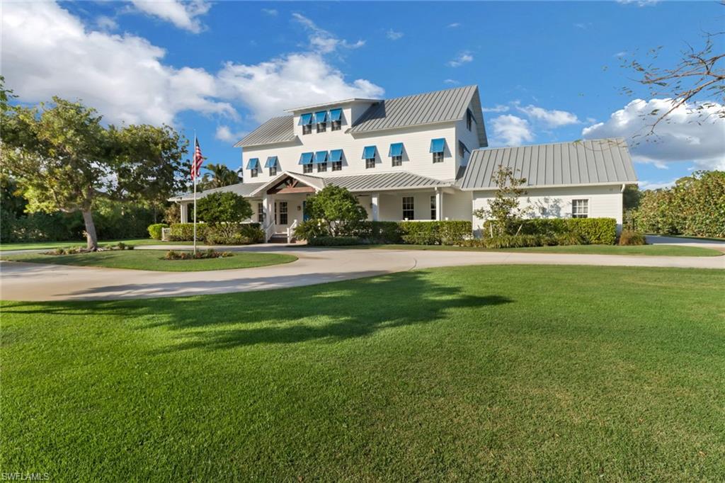 Pine Ridge Estates is sought after for its proximity to all best Naples has to offer, the beach, 5th Avenue, outstanding schools, fine dining, shopping, entertainment.  The streets are friendly for walking and bicycle riding, lots are expansive, and there are no homeowners associations.  This timeless home is in the most desirable FEMA Flood Zone X.  (This designation was recently corrected and the FEMA letter is available upon request.  Some websites still list the erroneous flood zone.).  Constructed with quality, this architectural landmark on 1.22 acres, was designed in conjunction with the current owners by David Corban Design, and custom built by Lundstrom Development.  Featured in Gulfshore Life, this home features two primary bedrooms including one on the main floor.  Other well-designed features include all ensuite bedrooms, spacious wraparound front porch, movie room with double wall construction, deep saltwater pool, saltwater spa, expansive covered outdoor deck, outdoor kitchen, cabana bath, mud room, large parking pad for boat and other recreational vehicles, storage everywhere, impact windows, completely fenced yard, electric vehicle charging, and so much more!  Set in a private and peaceful oasis accentuated by native plant landscaping to enhance natural beauty while reducing maintenance.  Fruit trees provide tropical appeal.  The spacious, finished third floor offers endless potential for a playroom, hobby room, exercise room, game room.  Ideal location is close to sugar sand beaches, the sparkling allure of fabulous 5th Avenue, the enduring charm of Venetian Village, and the ubiquitous appeal of Mercato center.  All this with a history of remaining safe from storms.  SEE FOR YOURSELF WHILE THIS HOME REMAINS ON THE MARKET.