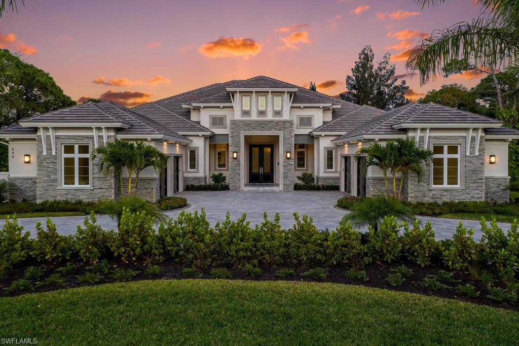 This brand new custom built estate by DIVCO is situated in Pine Ridge on over an acre of land and is built with sleek elements that make this a sought-after gem in the Naples area. Rooms are spacious, and include 4 bedrooms plus a den, bonus room, 5 full and 2 half  bathrooms, all spread over 5,289 square feet under air and 8,601 square feet total. Upgrades and other room notables are only fitting for an estate home of this magnitude, and include a dramatic double-door entry complete with a raised foyer, soaring beams in the great room, detailed crown moldings, and additional decorative features, wood coffered and tray ceilings for added appeal, gourmet kitchen with fine modern appliances, custom cabinetry, large walk in pantry and custom glass wine chilled room, custom tile and wood flooring, pocket sliding doors that help bring the outdoor beauty, wet bar, 4-car garage, home generator, utility room and much more. The lanai is a true retreat, with a spectacular pool and spa with a sun shelf, water features, linear fire pit, outdoor kitchen, and multiple seating areas for entertaining. This home is conveniently located to Naples finest beaches, restaurants & shopping!