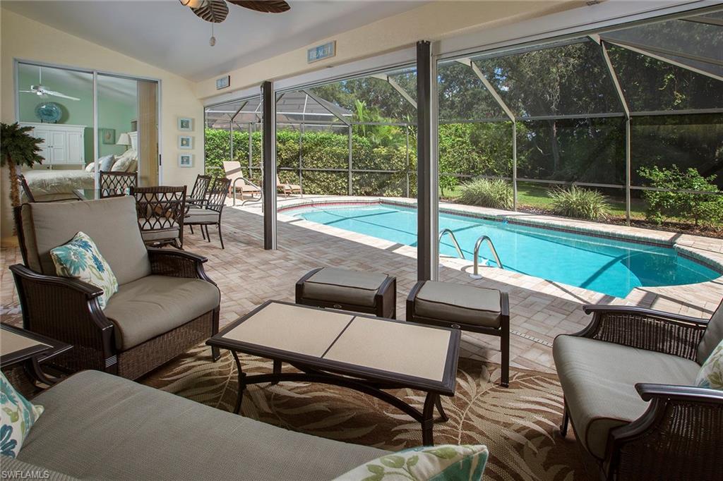 The perfect chance to own a piece of Paradise. This open and updated home has been absolutely loved. Carefully decorated in an on-trend seacoast style, it is move-in ready. Kitchen and baths have been updated, AC was replaced in 2011, hot water heater is new, and pool equipment has all been replaced since 2009, including the addition of an electric heater. The home is completely protected by storm shutters on all windows, a tubes-in-the-wall pest control and termite baiting systems, and alarm system. Entertaining is a joy outside on the pavered lanai with generous under-cover space overlooking a private yard. A brand new roof has been contracted and will be completed in November 2016. Carefully curated furniture package is available.